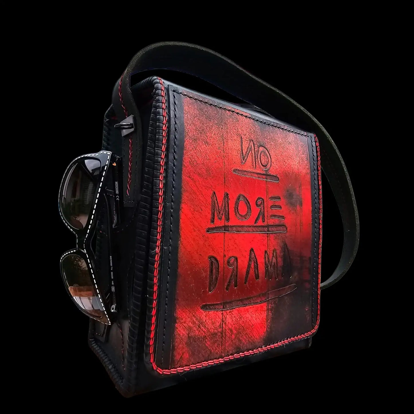 Handmade dark leather bag with red painted lettering and a face - AG Design, Arad, Romania