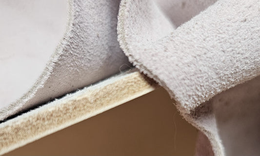 Vegetable-tanned leather folded to show the soft underside and the cut edge - AG Design, Arad, Romania