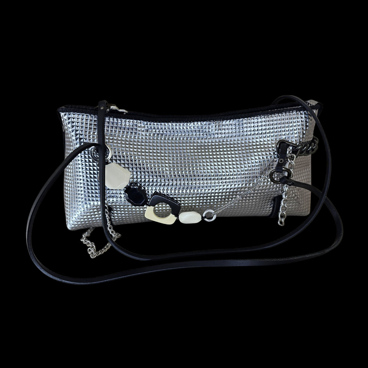 Handmade silver geometric leather crossbody bag with black and cream stones and silver chains, front view on black - AG Design, Arad, Romania