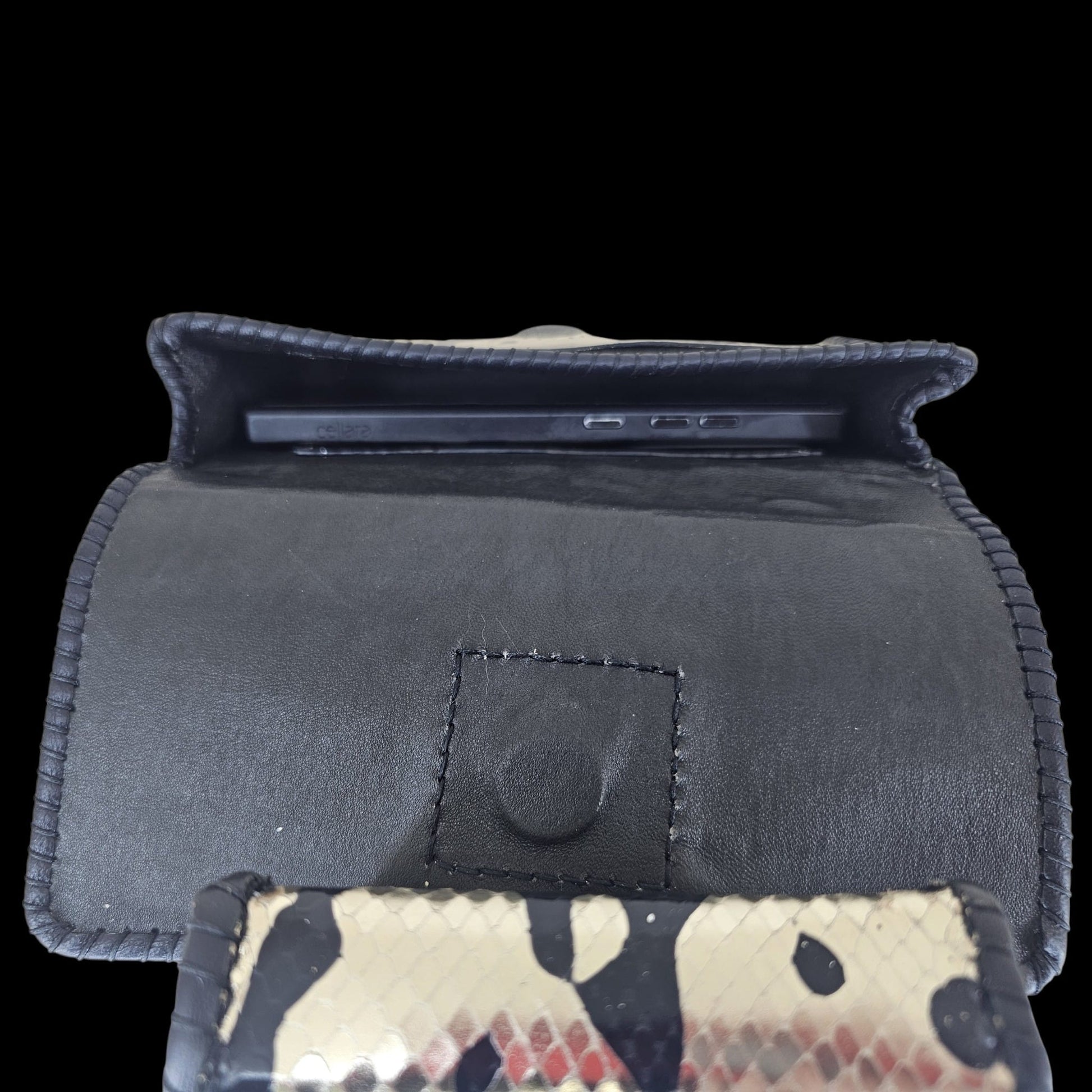 Phone inside the leather-lined pouch of a handmade gold leather crossbody bag - AG Design, Arad, Romania