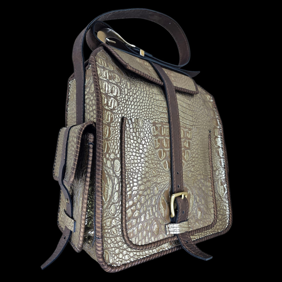 Angled side view of a handmade crocodile-embossed leather crossbody bag with brass buckle and stitched edges - AG Design, Arad, Romania