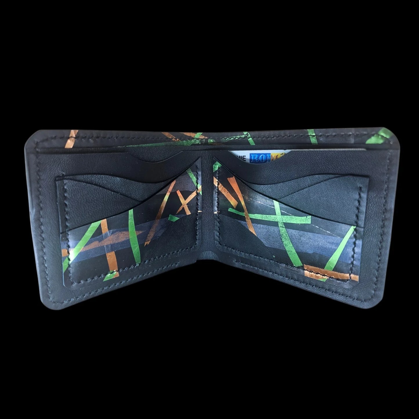 Handmade black leather wallet with abstract green, cobalt and bronze strokes and a central metal medallion - AG Design, Arad, Romania