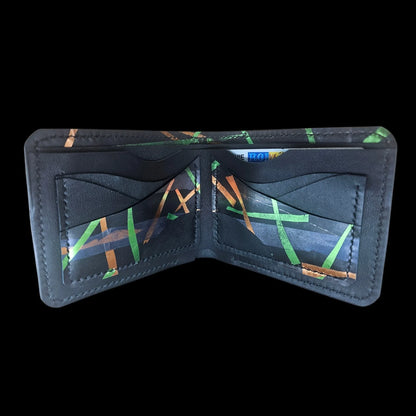 Handmade black leather wallet with abstract green, cobalt and bronze strokes and a central metal medallion - AG Design, Arad, Romania