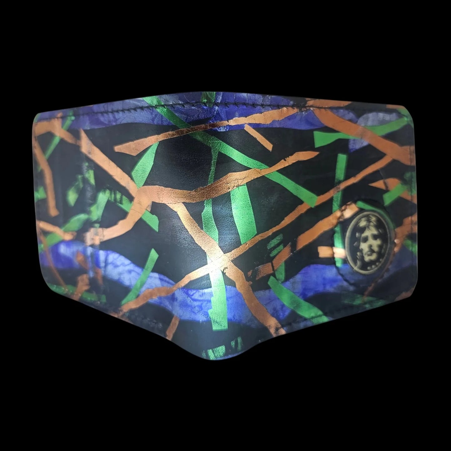 Handmade black leather wallet with abstract green, cobalt and bronze strokes and a central metal medallion - AG Design, Arad, Romania