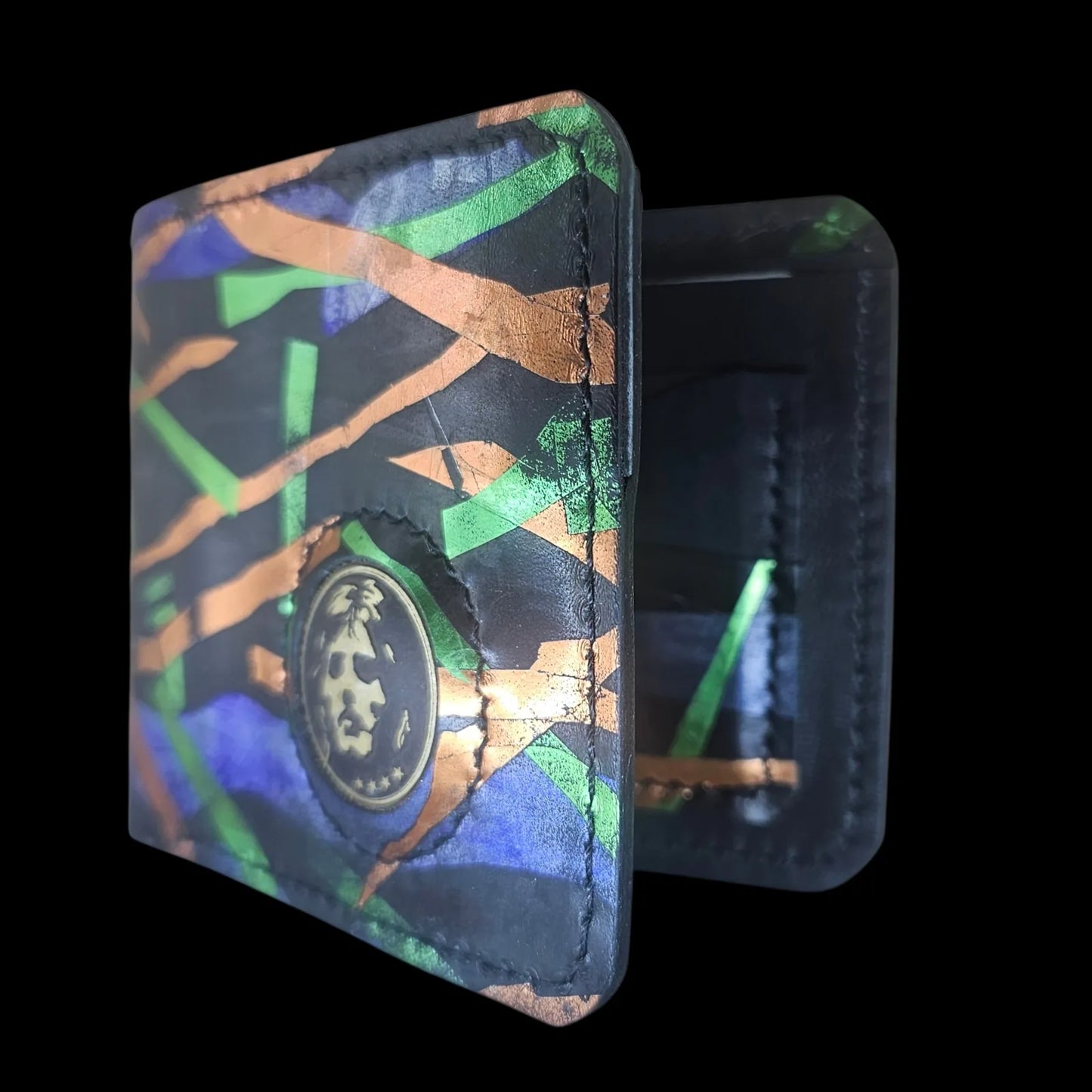 Handmade black leather wallet with abstract green, cobalt and bronze strokes and a central metal medallion - AG Design, Arad, Romania