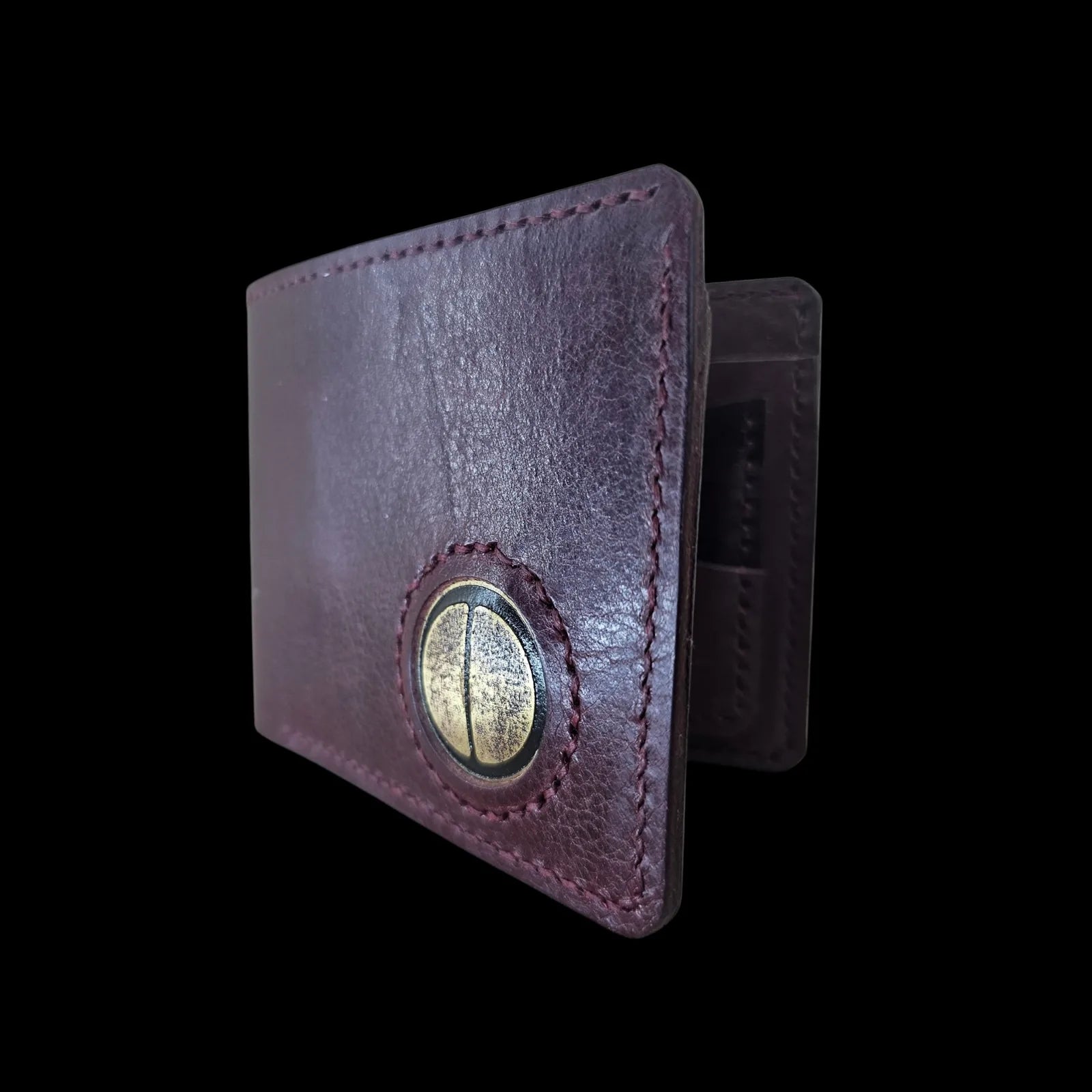 Handmade burgundy leather wallet with a metal medallion of Brancusi's Gate of the Kiss eyes - AG Design, Arad, Romania