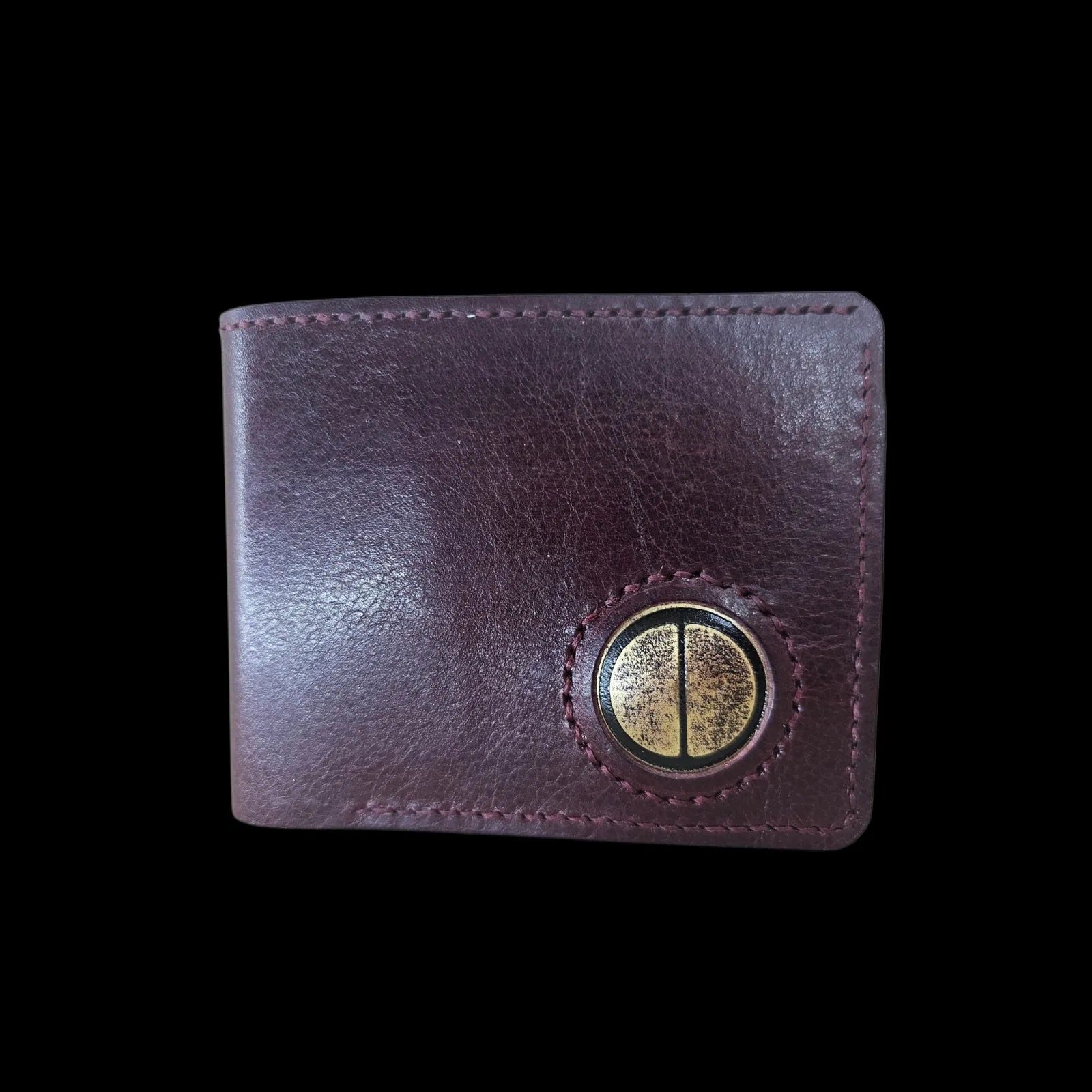 Handmade burgundy leather wallet with a metal medallion of Brancusi's Gate of the Kiss eyes - AG Design, Arad, Romania