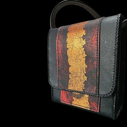 Handmade black leather shoulder bag with a red and gold clock mechanism embossed by heat and pressure - AG Design, Arad, Romania