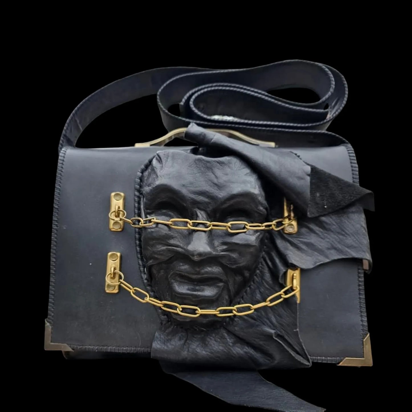 Handmade dark leather bag with a painted mask-like face and gold detail - AG Design, Arad, Romania