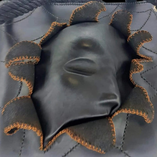 Handmade tan leather bag with a sculpted face in relief - AG Design, Arad, Romania