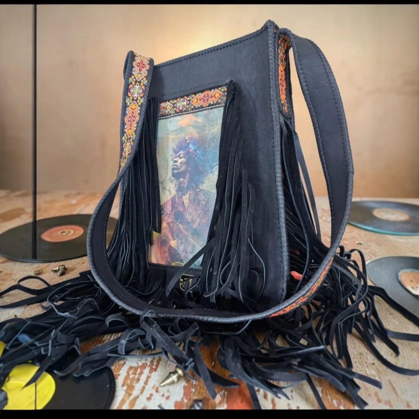 Handmade brown leather crossbody bag with a hypnotic photo transfer framed by long bohemian fringe and an embroidered strap - AG Design, Arad, Romania