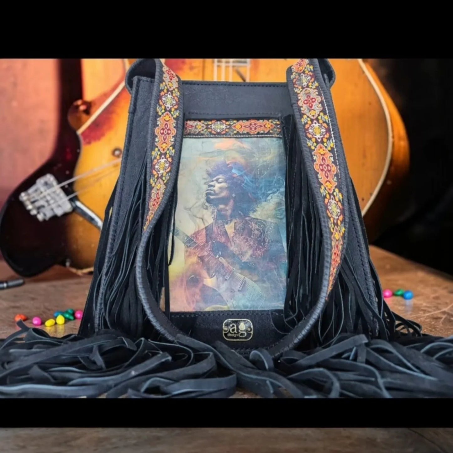 Handmade brown leather crossbody bag with a hypnotic photo transfer framed by long bohemian fringe and an embroidered strap - AG Design, Arad, Romania