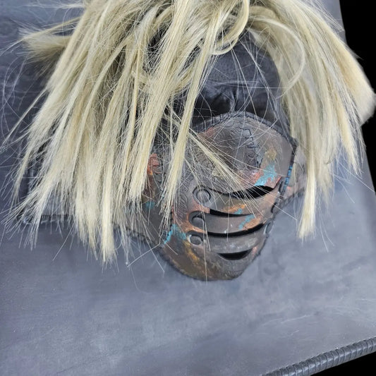 Handmade black leather shoulder bag with an attached 3D sculptural leather mask with metallic and hair-like textures - AG Design, Arad, Romania
