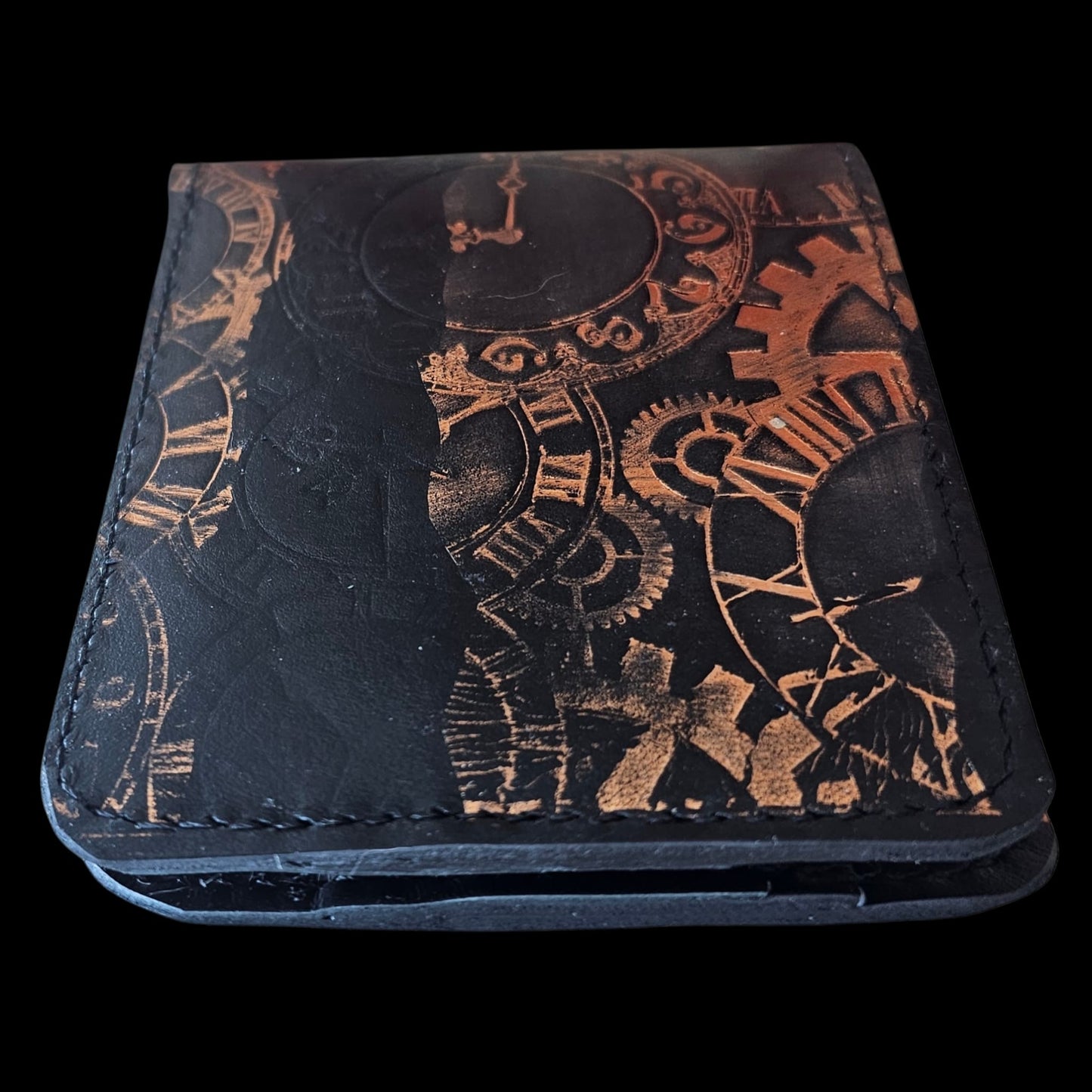 Close-up of copper clockwork and roman numerals worked into black leather - AG Design, Arad, Romania