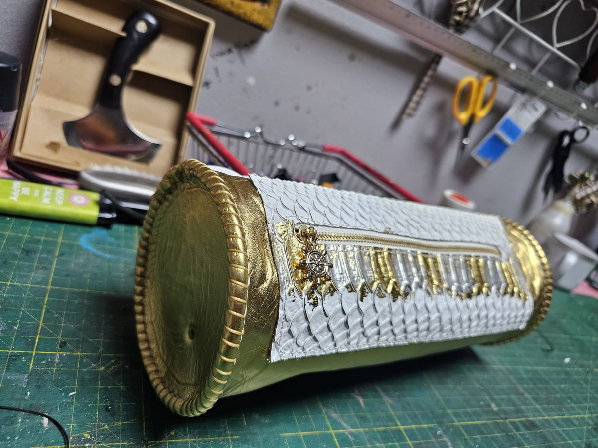 Inside of the handmade white and gold leather barrel bag, with a zipped pocket and a small ship's wheel on the pull - AG Design, Arad, Romania