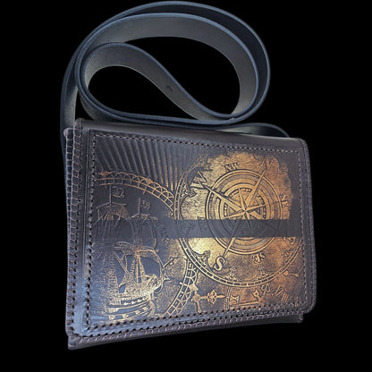 Front of a handmade brown leather shoulder bag with a compass, a ship and a clock dial pressed into the leather - AG Design, Arad, Romania