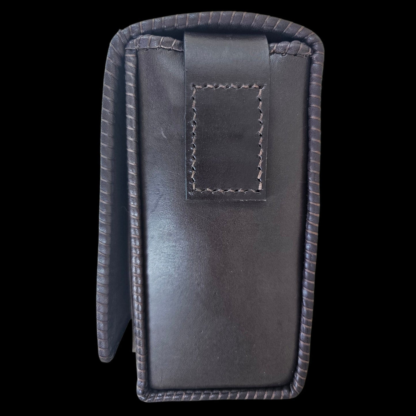 Side view of a handmade brown leather shoulder bag showing hand-stitched edges - AG Design, Arad, Romania