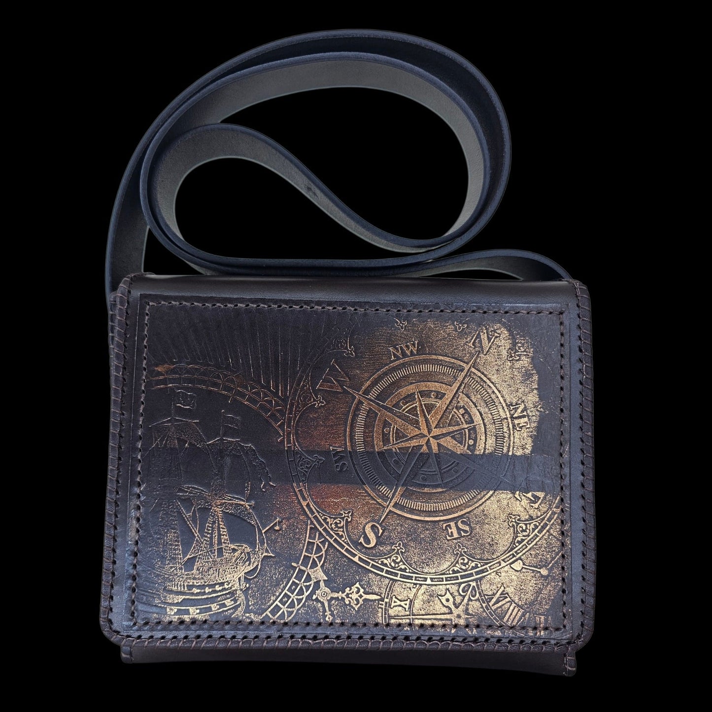 Front view of a handmade brown leather shoulder bag with compass motif and shoulder strap - AG Design, Arad, Romania