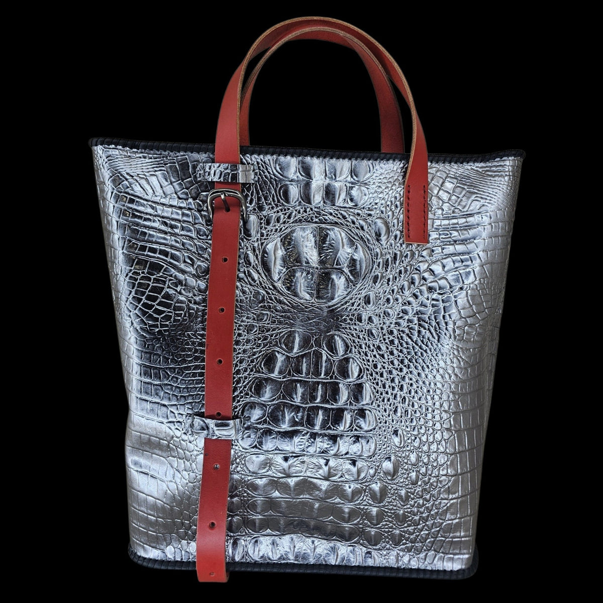 Front view of a handmade silver crocodile-embossed leather shoulder bag, shown up close - AG Design, Arad, Romania.