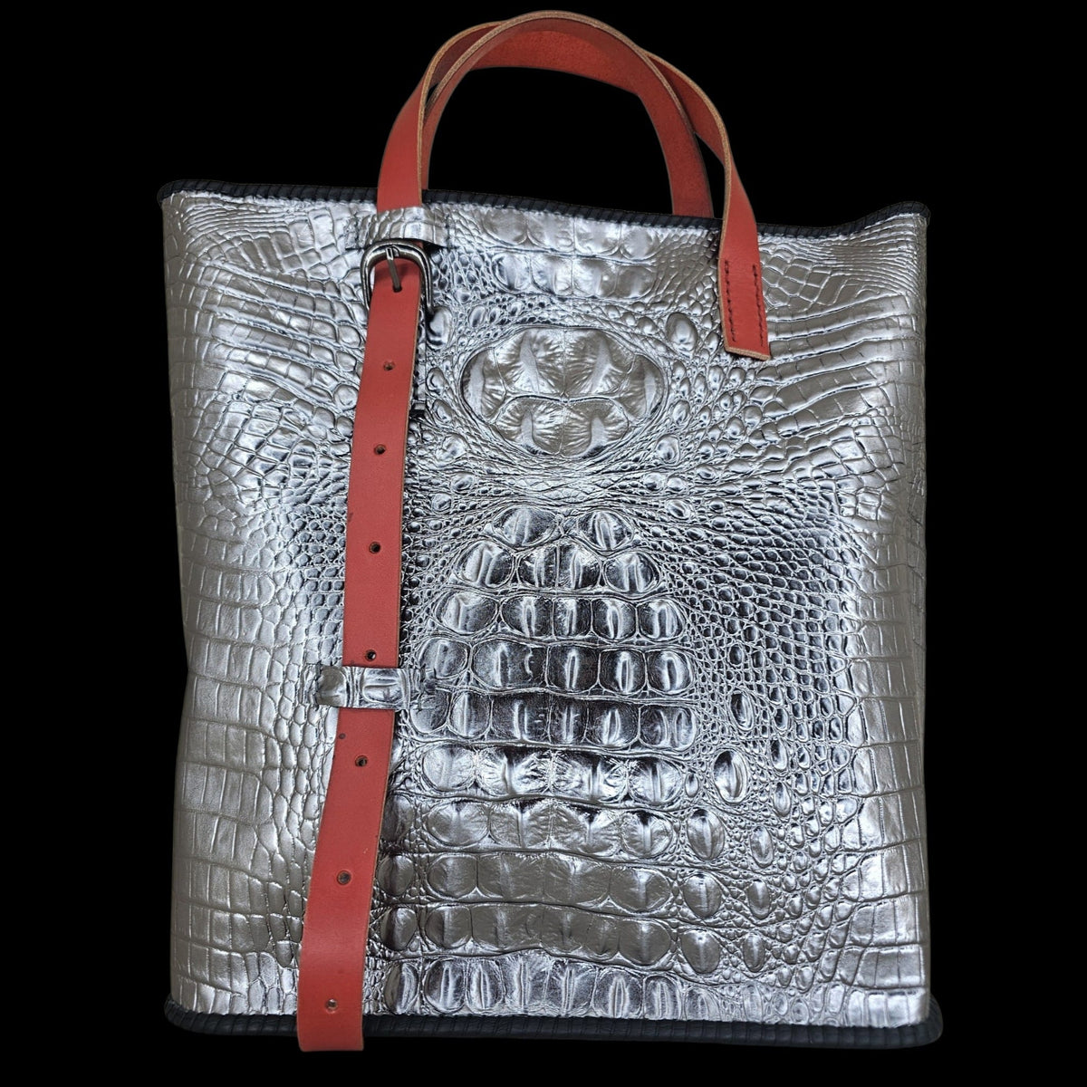 Front view of a handmade silver crocodile-embossed leather shoulder bag with a red adjustable strap - AG Design, Arad, Romania.