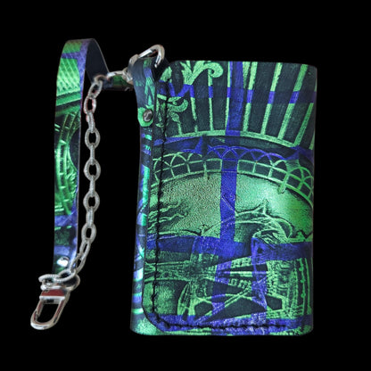 Close-up of the heat-pressed pattern in emerald green and royal blue on a handmade black leather wallet - AG Design, Arad, Romania
