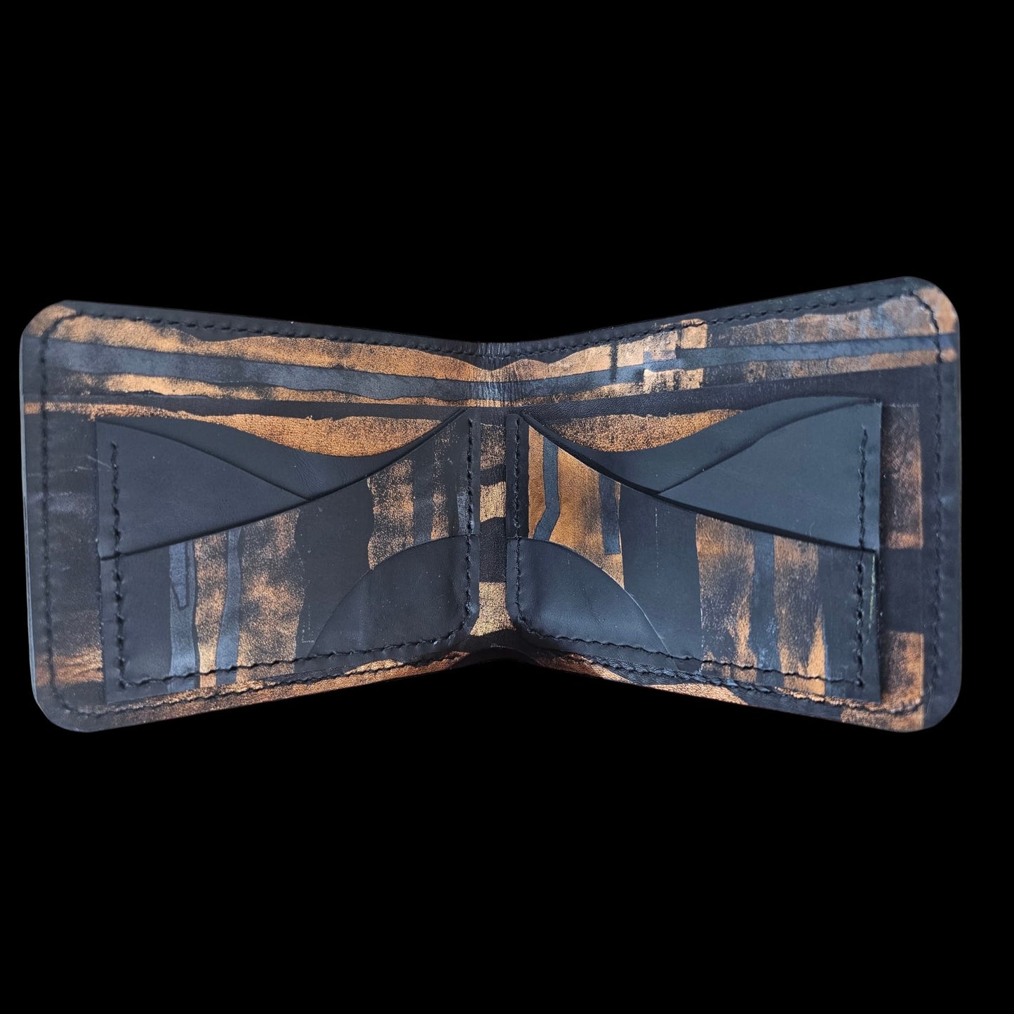 Bands of copper across the black leather of a handmade wallet, like stacked horizons - AG Design, Arad, Romania