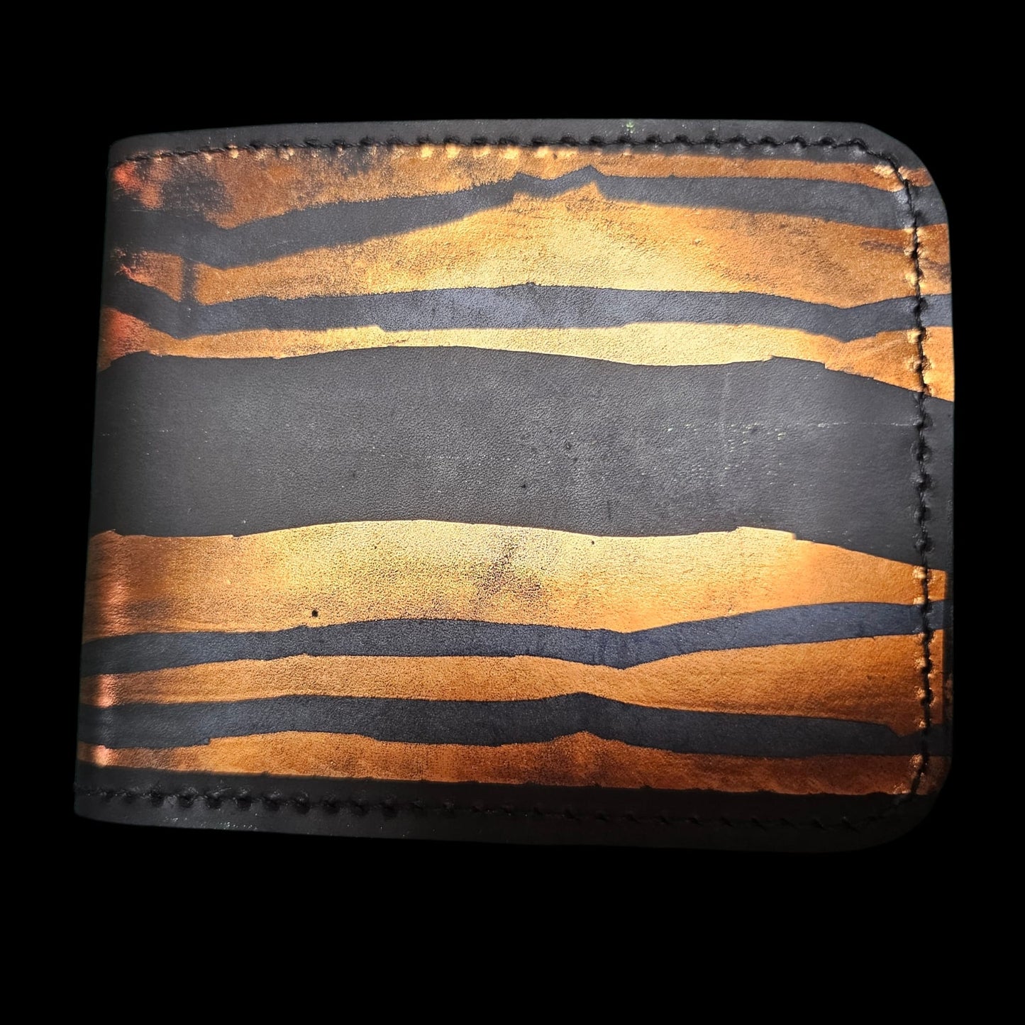 Close-up of copper worked into black leather under heat and pressure - AG Design, Arad, Romania