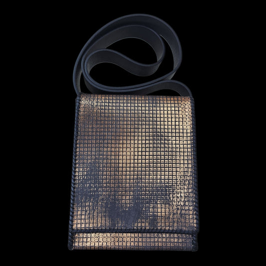 Handmade grey leather crossbody bag with a hand-stamped copper pattern, shown from the front with the strap draped over the top - AG Design, Arad, Romania.