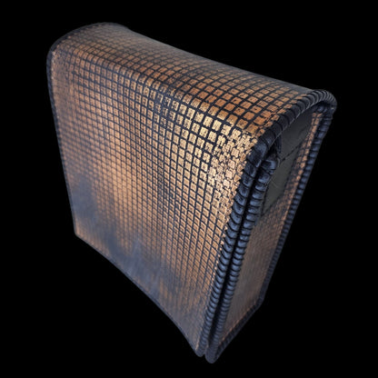 Side view of a handmade grey leather crossbody bag with a hand-stamped copper pattern, shown from a different angle - AG Design, Arad, Romania.