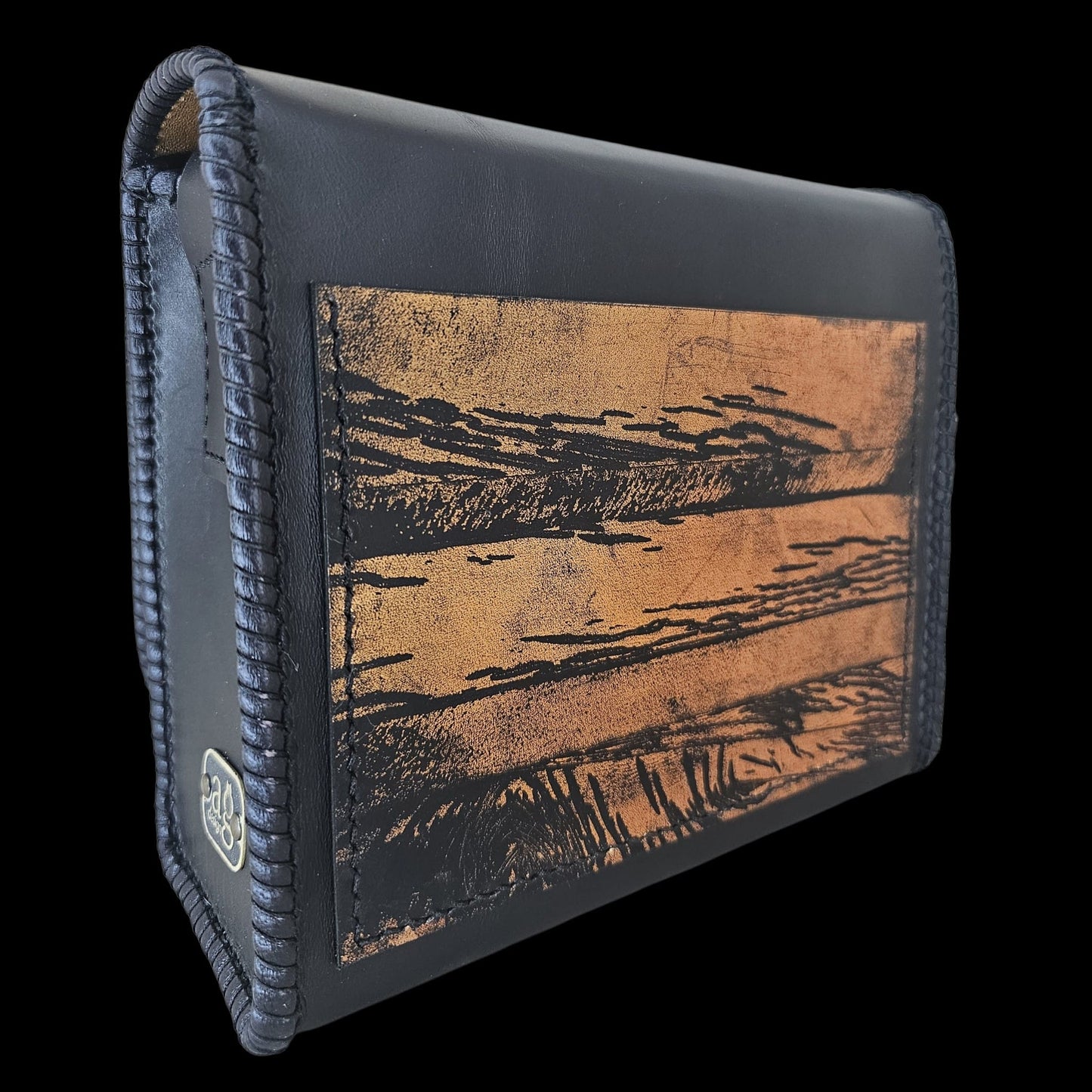 Back of a handmade black leather crossbody bag with a hand-worked gold panel - AG Design, Arad, Romania
