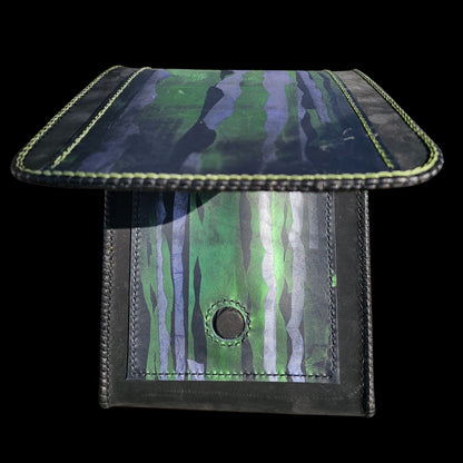 Handmade leather shoulder bag with the flap lifted, showing the painted outer pocket and the magnet closure - AG Design, Arad, Romania