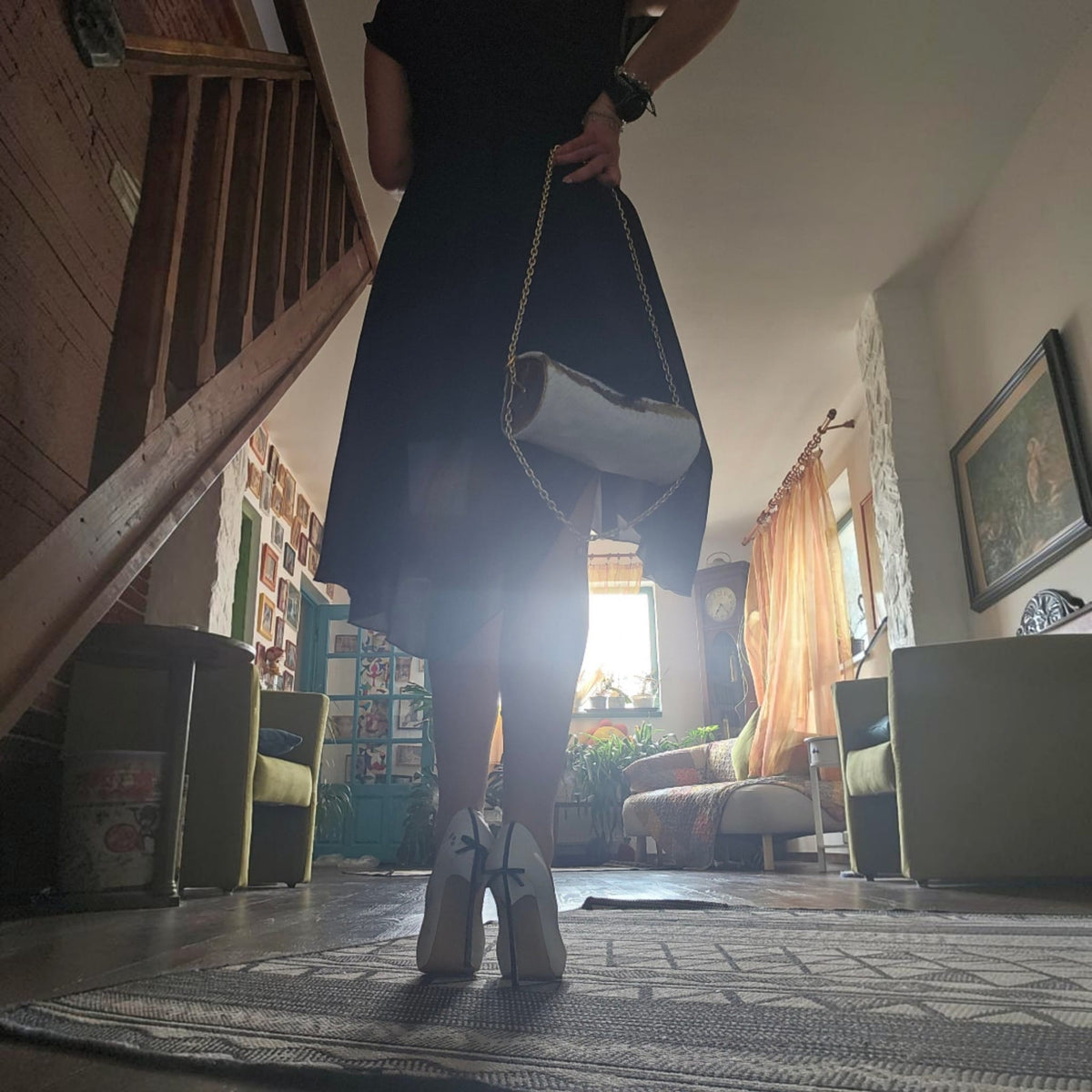 Handmade white leather barrel bag on a gold-tone chain, worn with a black dress and white heels in warm light - AG Design, Arad, Romania