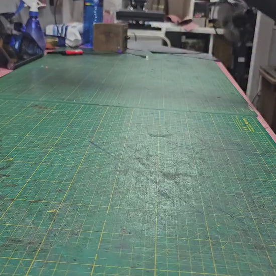 Leather being cut and pressed with heat, the technique behind this handmade wallet - AG Design, Arad, Romania