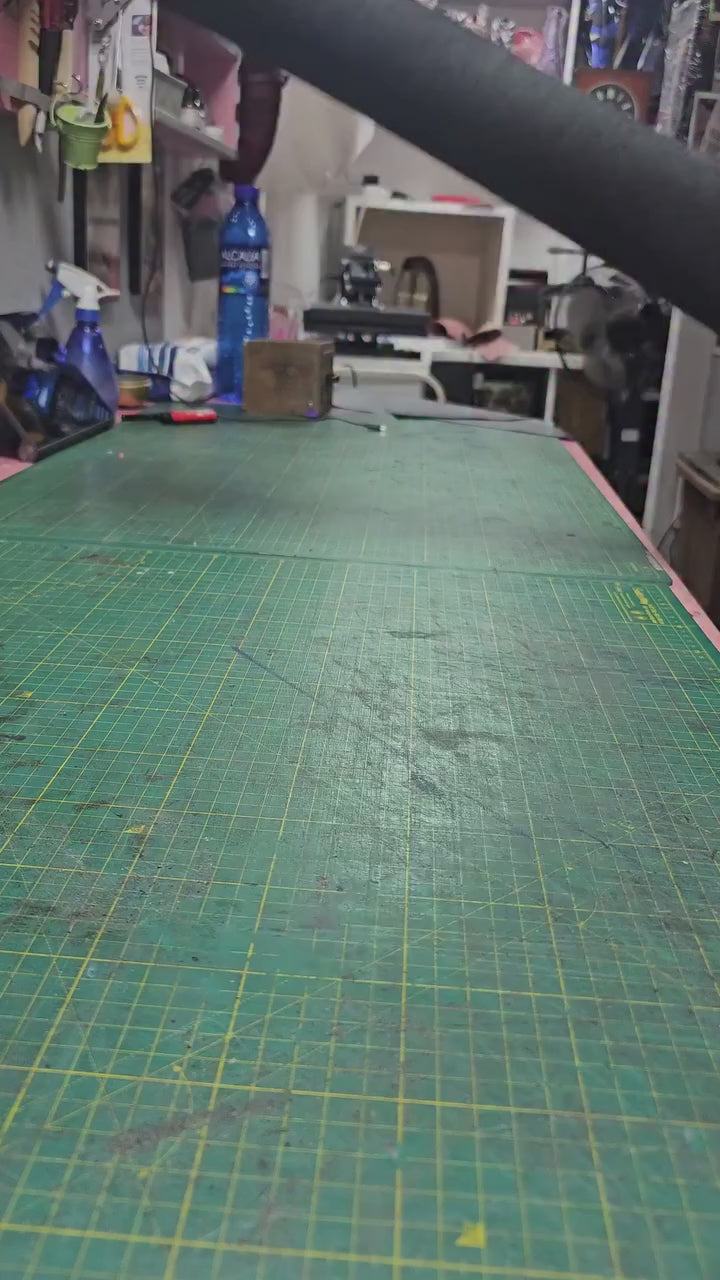 Leather being cut and pressed with heat, the technique behind this handmade wallet - AG Design, Arad, Romania