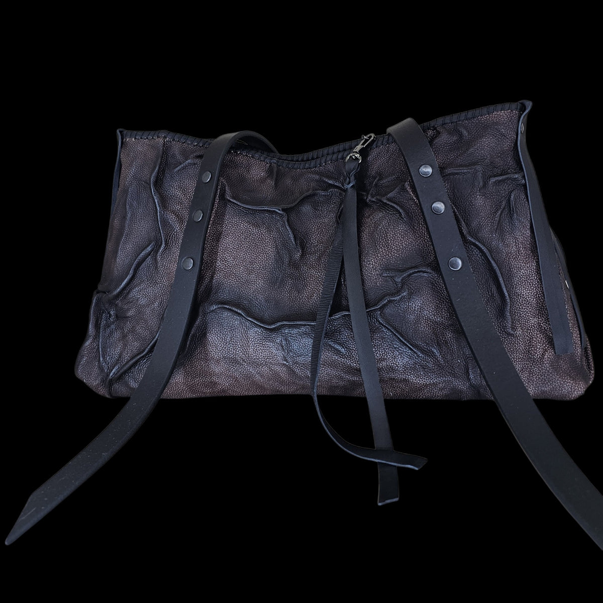 Handmade relief leather shoulder bag in brown and black, its long straps falling loose - AG Design, Arad, Romania