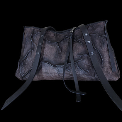 Handmade relief leather shoulder bag in brown and black, its long straps falling loose - AG Design, Arad, Romania