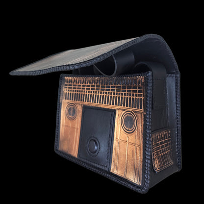 Handmade leather shoulder bag with the flap lifted, showing the whole gate embossed on the inside - AG Design, Arad, Romania