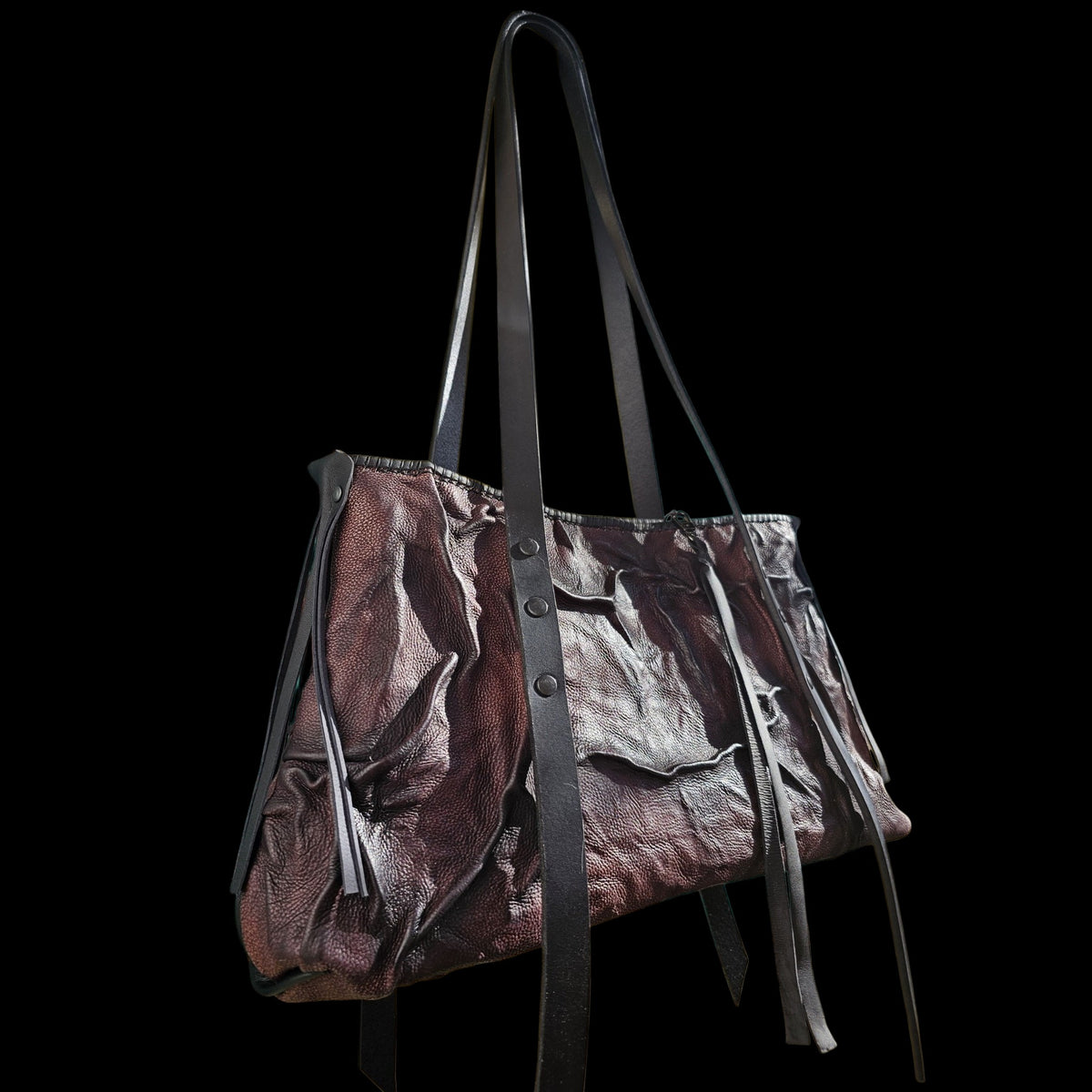 Handmade shoulder bag in airbrushed relief leather, brown fading into black, against a dark background - AG Design, Arad, Romania