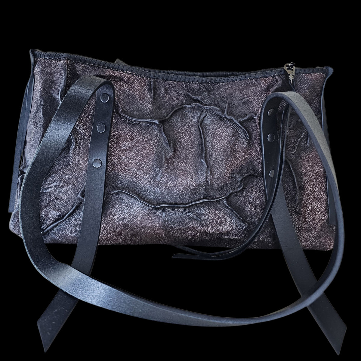 Handmade brown and black leather shoulder bag with a surface like ground after a storm, lit from the side - AG Design, Arad, Romania