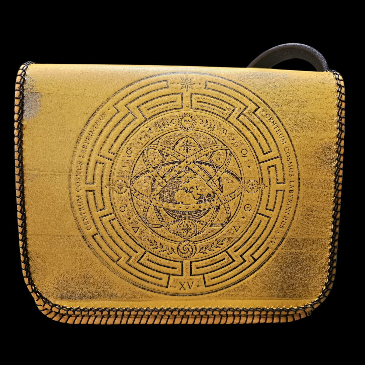 Front view of a handmade mustard yellow leather crossbody bag with an embossed armillary sphere - AG Design, Arad, Romania