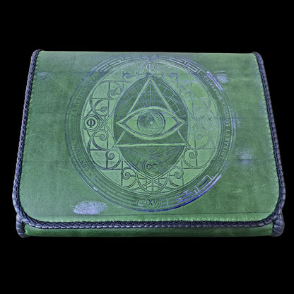 Front flap of a handmade green leather crossbody bag embossed in blue with an eye, the letter Phi and a Latin inscription - AG Design, Arad, Romania