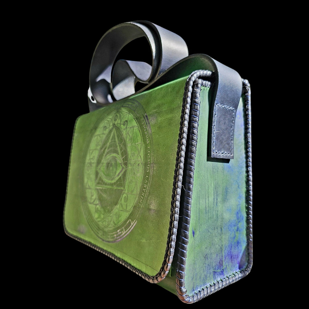 Side view of a handmade green leather crossbody bag showing the navy laced edges and blue-tinted gusset - AG Design, Arad, Romania